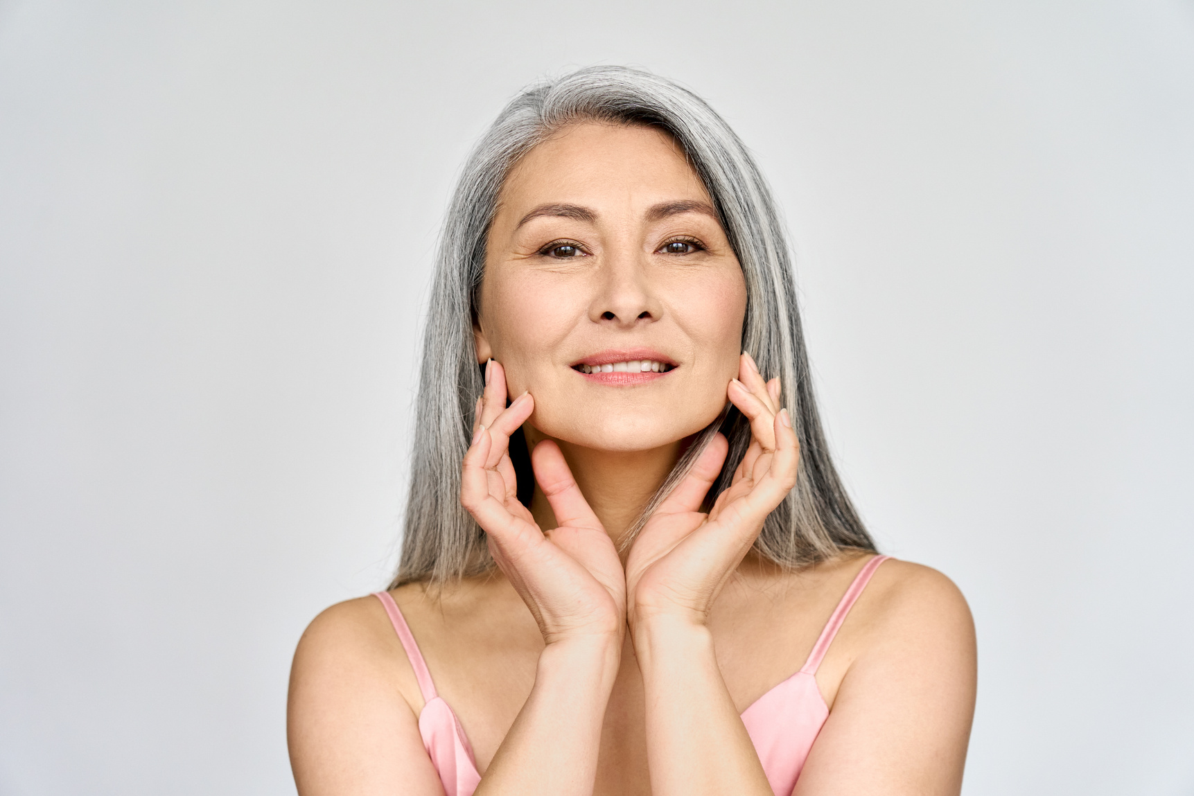 Gorgeous Middle-Aged Woman Touching Her Flawless Face